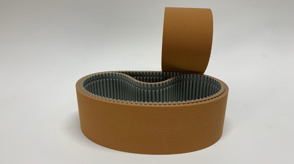 Timing belt with brown sylomer coating