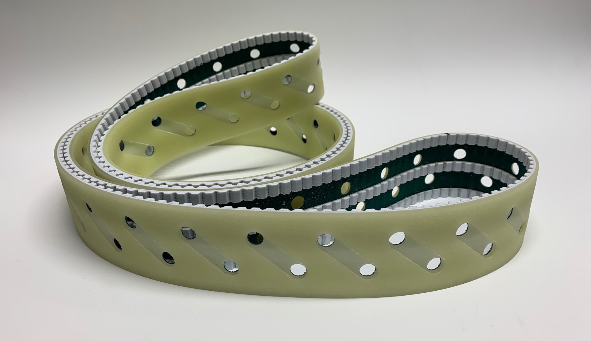 Timing belt with Polythan coating + waterjet holes and grinding